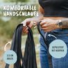 Die schwarze Schleppleine aus Stoff hat eine bequeme Handschlaufe und ist mit Neopren gepolstert.