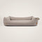 Orthopedic dog bed from Rudelkönig in gray upholstery fabric.